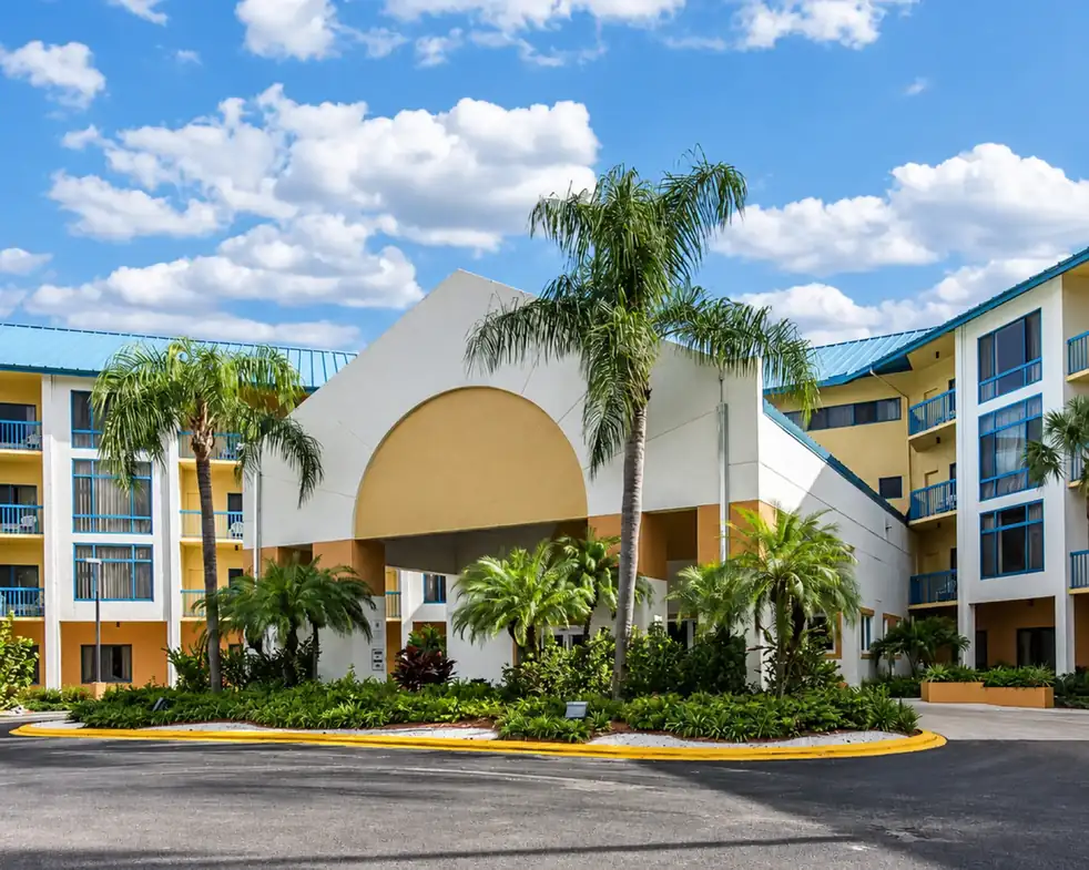 Tollgate Inn exterior with tropical landscaping
